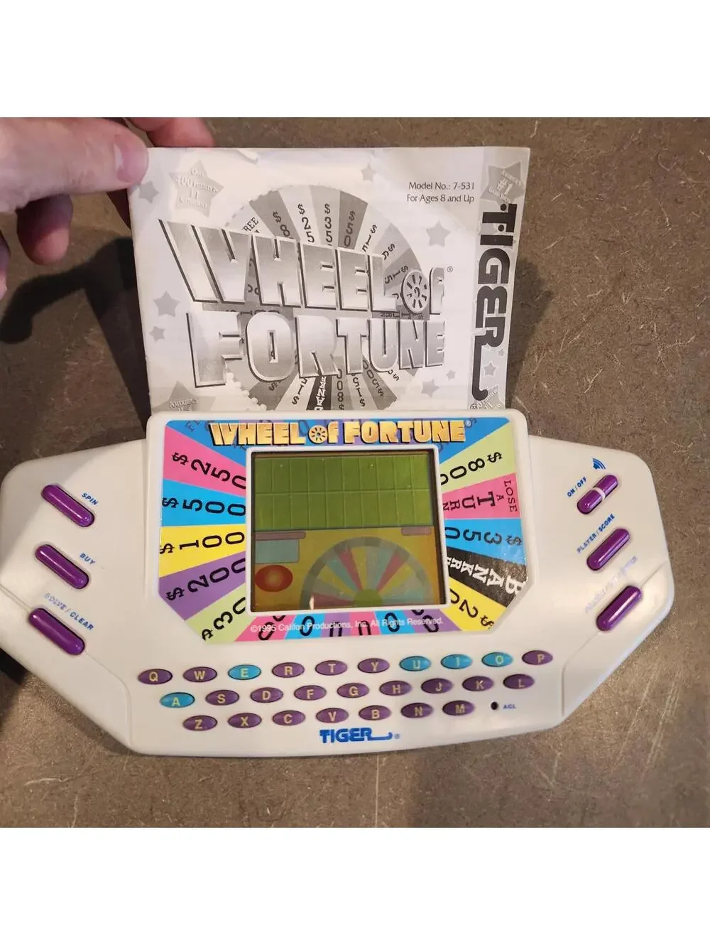 Wheel of Fortune Handheld Electronic Game works perfect EUC condition booklet